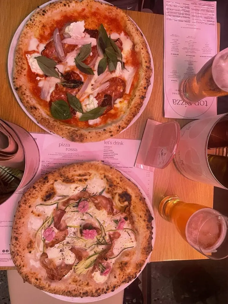 The cozy interior of Olio Pizza Napoletan with pizzas